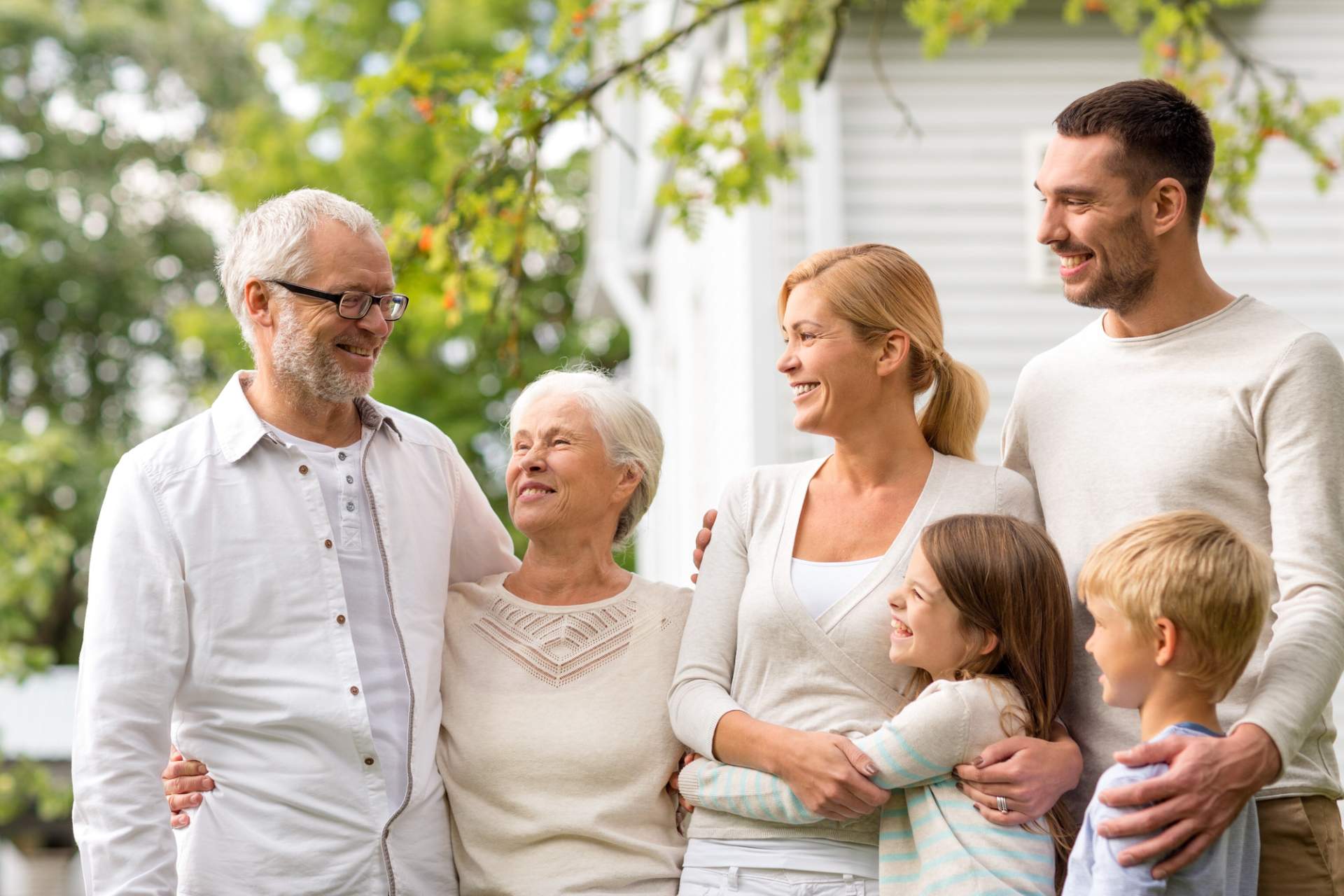 Multi-generational family hugging